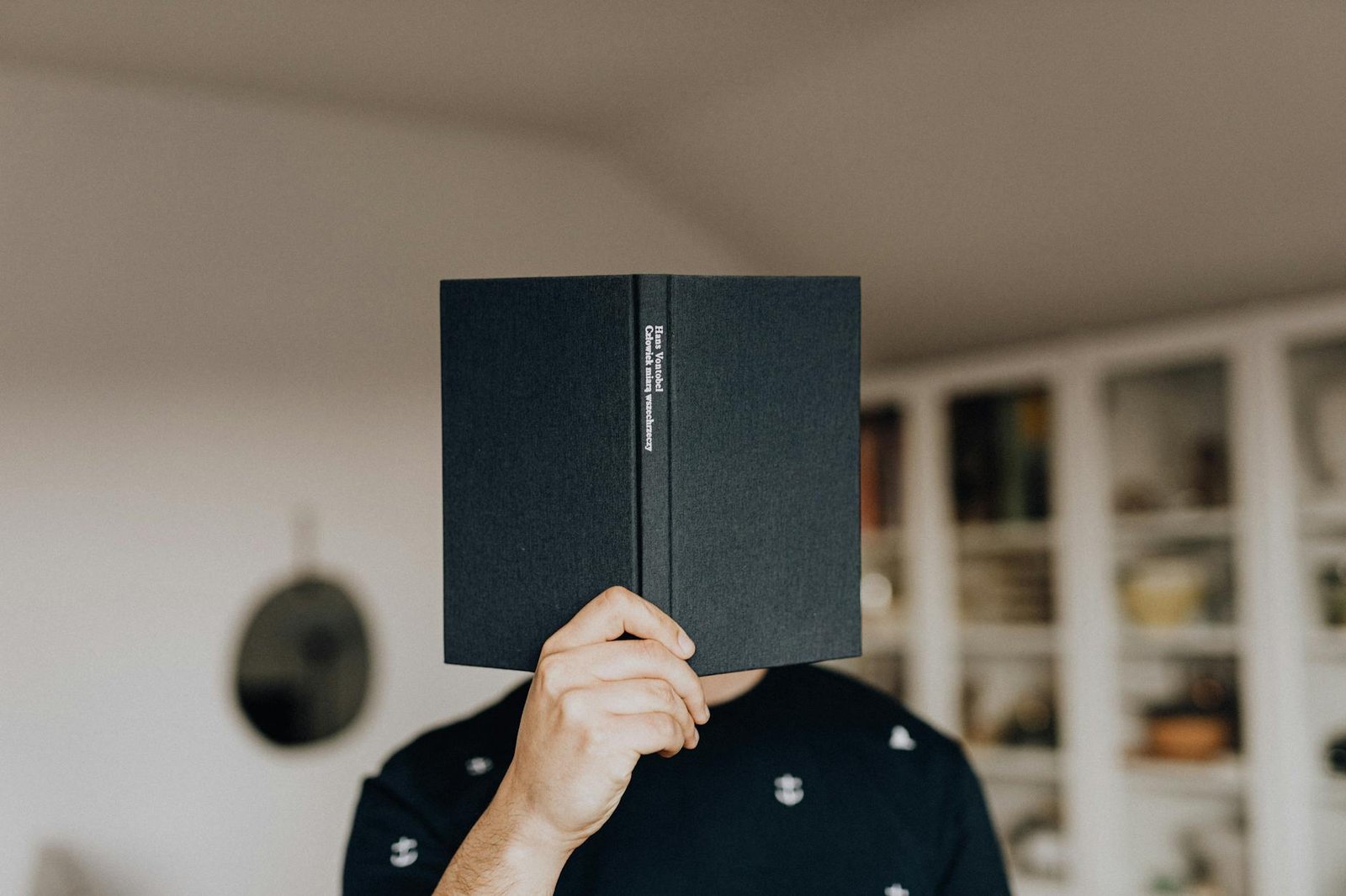 anonymous man with book in hand